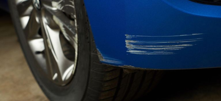 Parked blue damaged car
