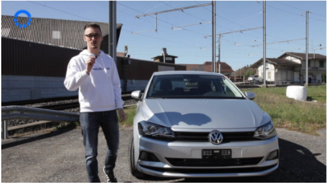 Man in front of VW Polo